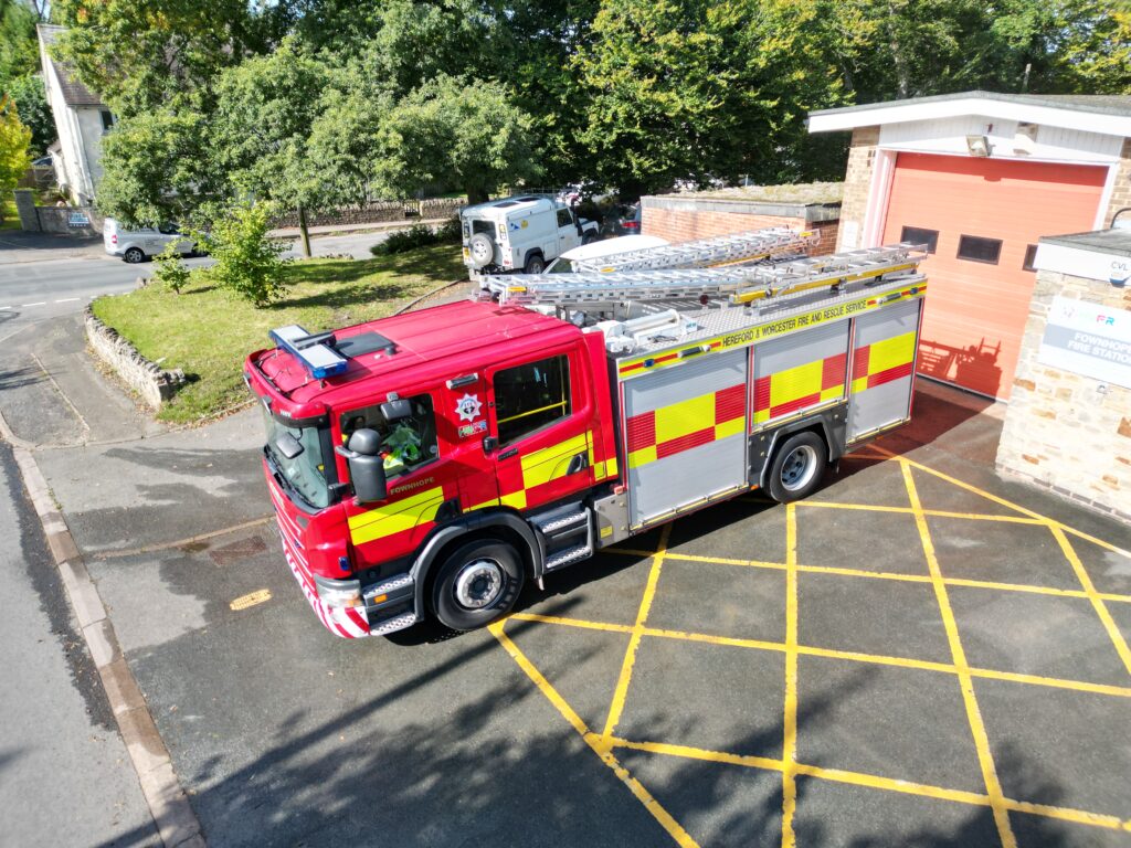 Fire engine in front of station taken from above