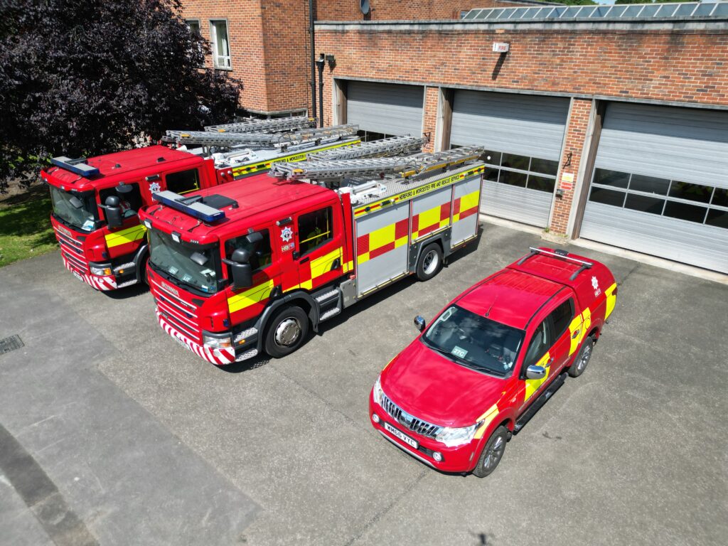 Three fire vehicles at front of fire station taken from above