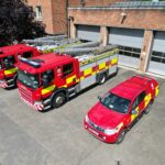 Three fire vehicles at front of fire station taken from above