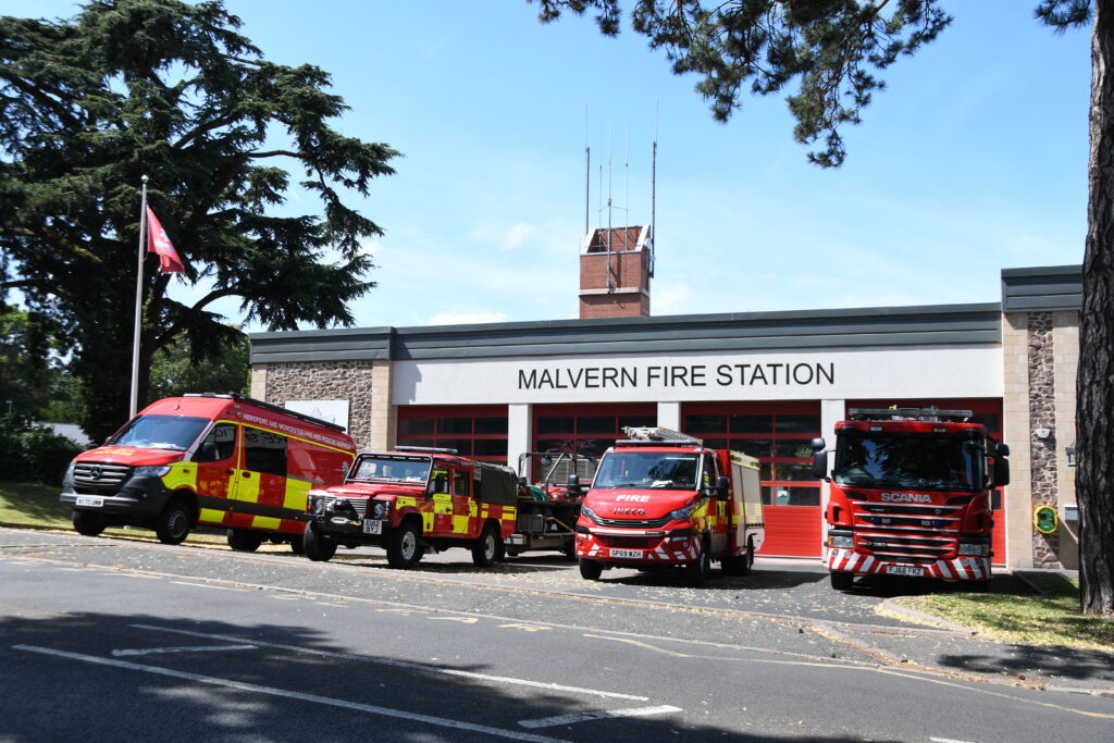 Fire vehicles in front of fire station from scross road