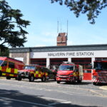 Fire vehicles in front of fire station from scross road