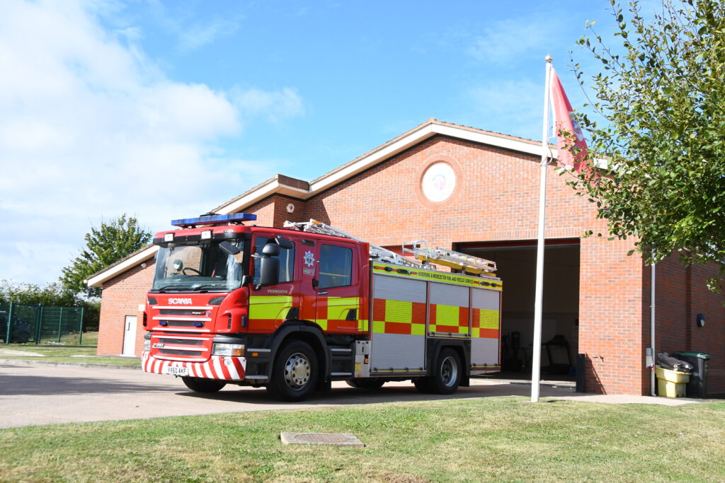 Fire engine in front of fire station