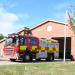 Fire engine in front of fire station