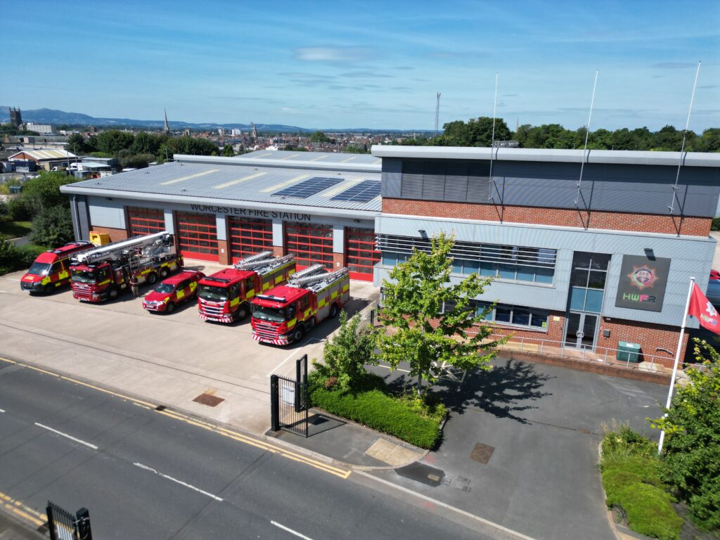 Drone image of fire station with fire vehicles