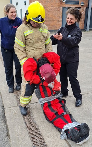 BBC Hereford & Worcester reporter Nina Das Gupta tackles firefighter tasks.